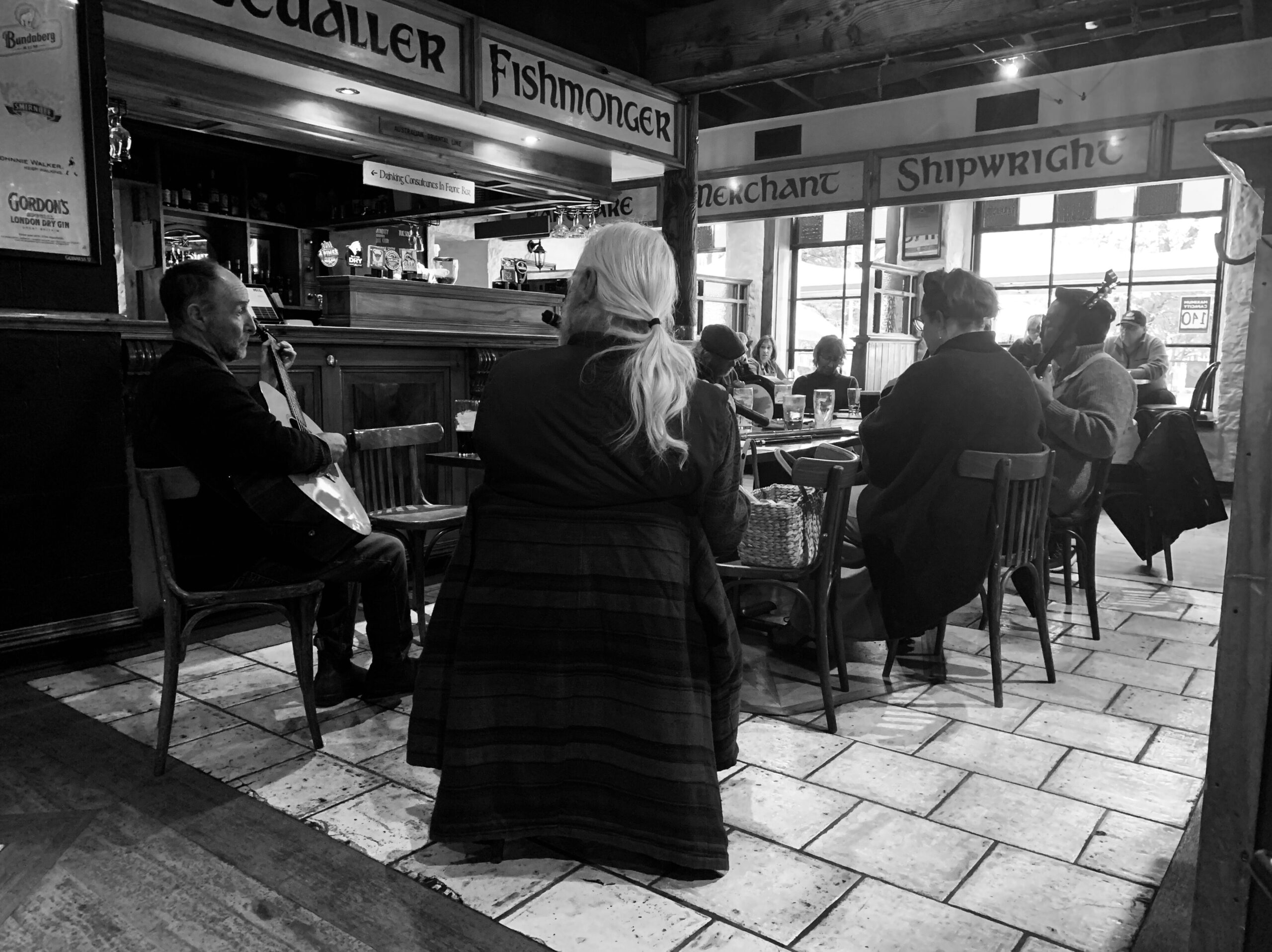 Group of musicians sitting around a table